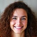 Avatar of Fiona Davies, a cheerful woman with curly brown hair.